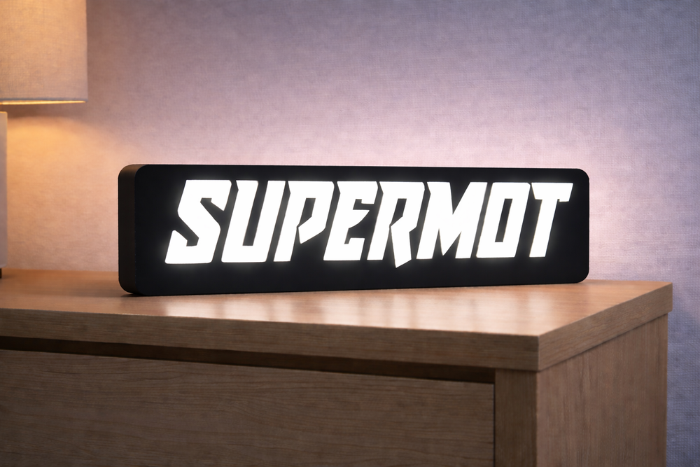 Lampe Supermot V1, boîtier noir et éclairage blanc